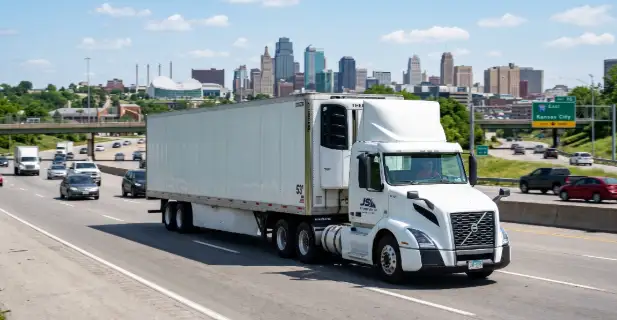Refrigerated transportation Kansas City truck carrying temperature controlled freight efficiently on highway by JS Transportation, LLC